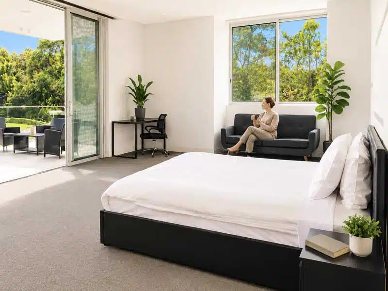 Guest relaxing in a private residential room at Tranquilo Wellness